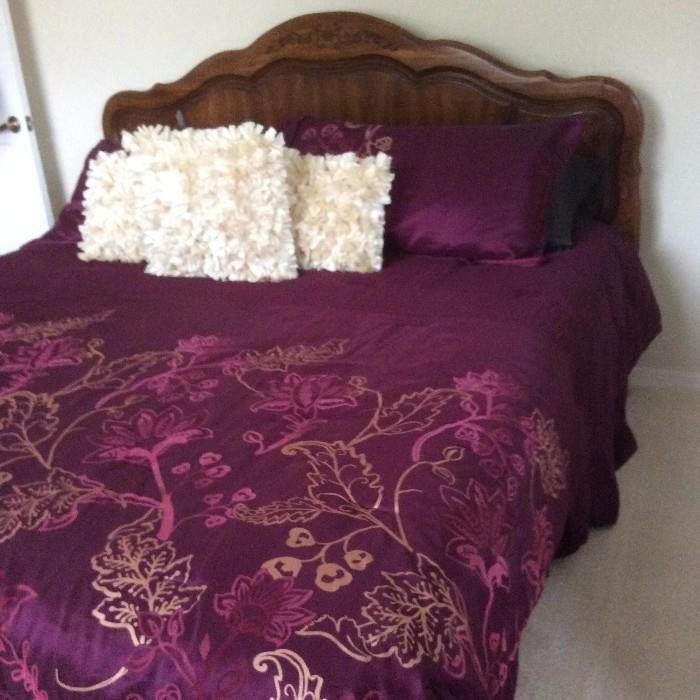 Queen Size Bed with Burgundy Linens
