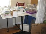 Very nice fold up sewing table, EZ lock machine and supplies.  Cutting boards too!