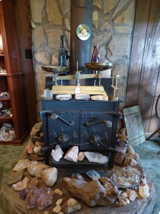 The wood stove is not or sale but all rock specimens & brass scale is