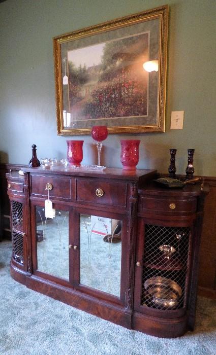 Mahogany etched glass door sideboard with brass galley on top of each curved side.  This would make a cool bar 