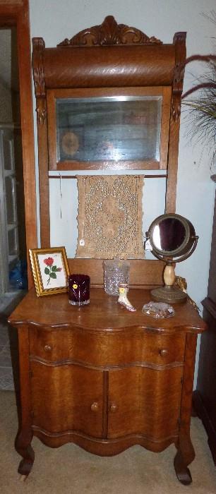 Antique oak serpentine front wash stand with mirror