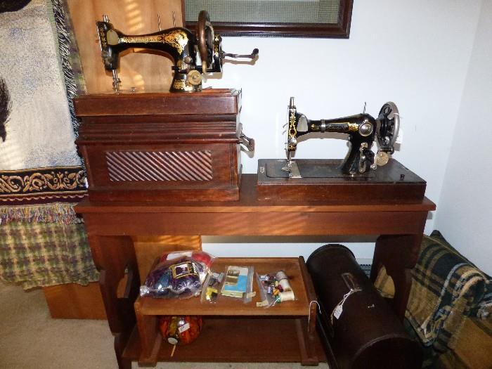 Antique Singer & Eldridge sewing machines with carrying cases