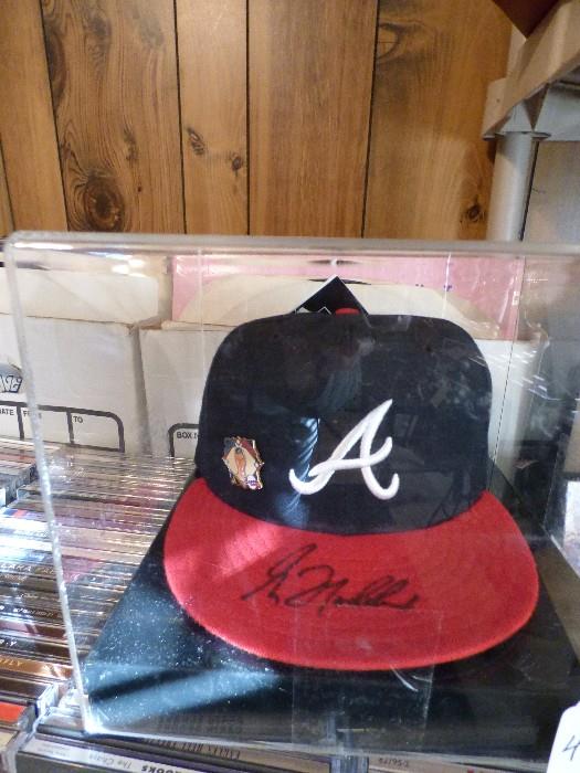 Atlanta Braves Greg Maddox autographed baseball cap in plastic case 