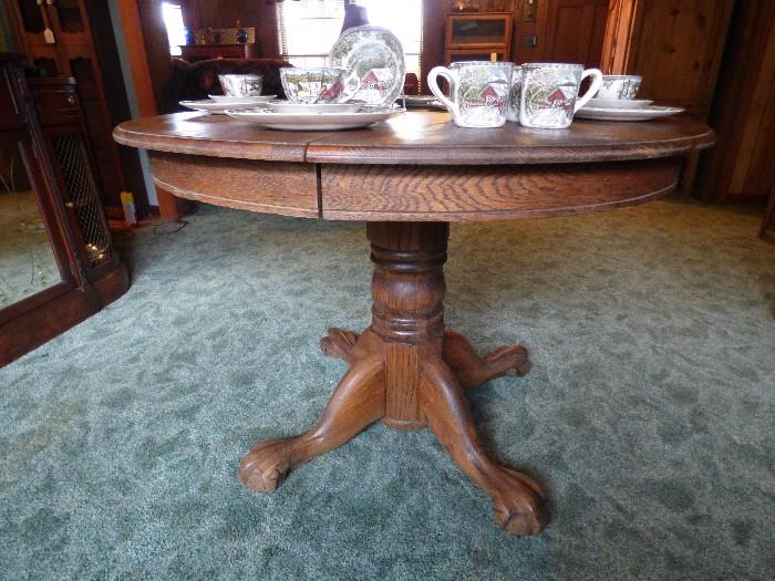 Vintage Oak pedestal table (has 1 leaf) with vintage Johnson Brothers (England) "Friendly Village" china