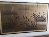 Asian screen. Located in the dining room.