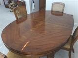 Dining room table; has 2 leaves and pads; 6 chairs.
