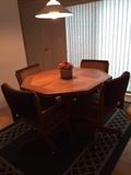 kitchen table, 4 chairs, rug.  All wood