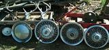 Wagons, hubcaps, deer skulls & old pump