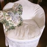 Slipcovered armchair - hiding beneath is an antique chair with green velvet upholstery