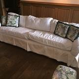Slipcovered casual chic sofa and loveseat, down wrapped cushions