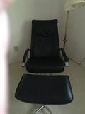 Black lounge chair with footstool