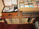 brand new record player, a small portion of the records and tapes ...