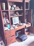 Solid wood desk filled with pottery