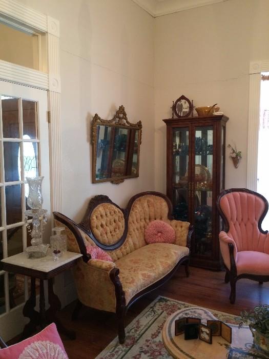 Cameo back sofa.  Pink velvet parlor chair.  Marble tops and antique plaster on wood framed mirrors. 