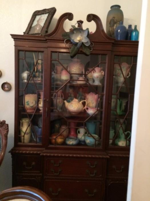 Roseville pottery, Weller pottery, McCoy, antique fairy lights, three door china cabinet with storage. 