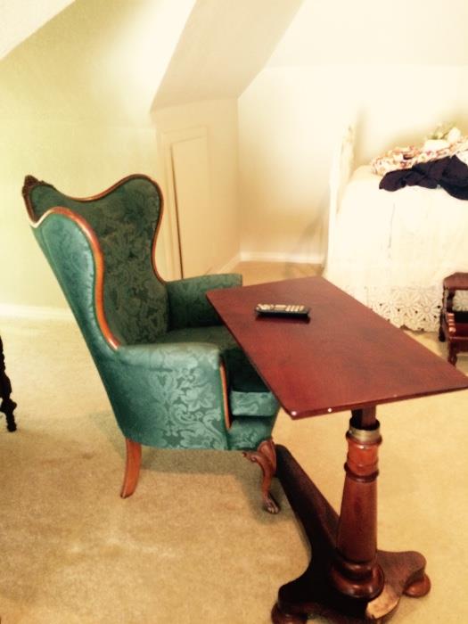 Teal wingback antique chair with writting table.  
