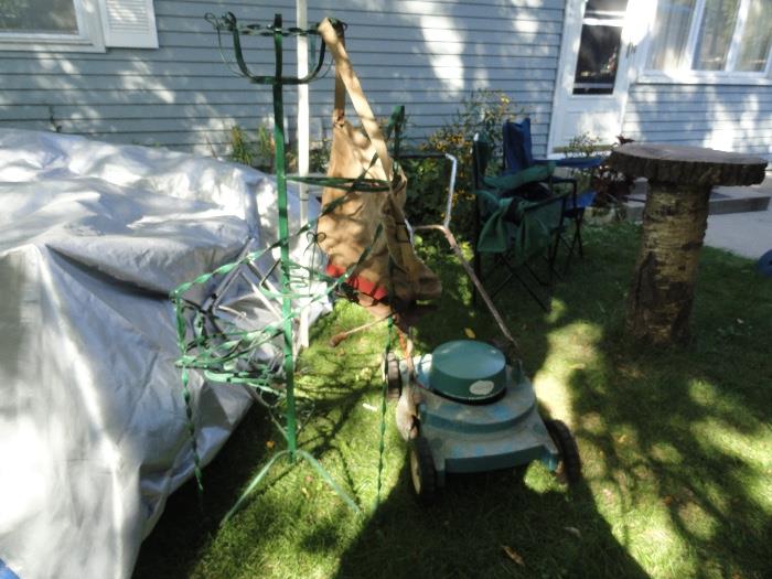 Iron plant stand, working electric mower