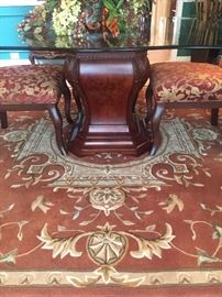 Wood pedestal base (glass top) dining table, the rug is approx. 7'9" in diameter