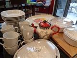 Several sets of dinnerware