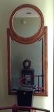 Faux Finished and Gilt Framed Beveled Mirror above Mirror reflecting Iron Pedestal holding Glazed Ceramic Vase