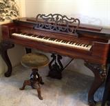 1860 Hornbraker Melodia reed pump organ and stool. Legs detach so you can pack it up into a box.