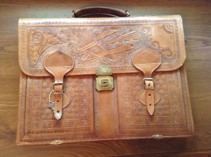 Intricate leather briefcase with key
