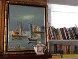 Seaside View Painting with Gold Bamboo Frame, teapot in front with books behind
