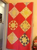 Handmade quilt with red fabric backing