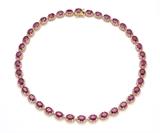 Lot 74: A RUBY AND DIAMOND NECKLACE