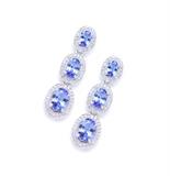 Lot 77: A PAIR OF TANZANITE AND DIAMOND EARRINGS
