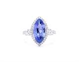 Lot 82: A TANZANITE AND DIAMOND RING
