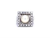 Lot 89: AN ART DECO DIAMOND AND PEARL RING 