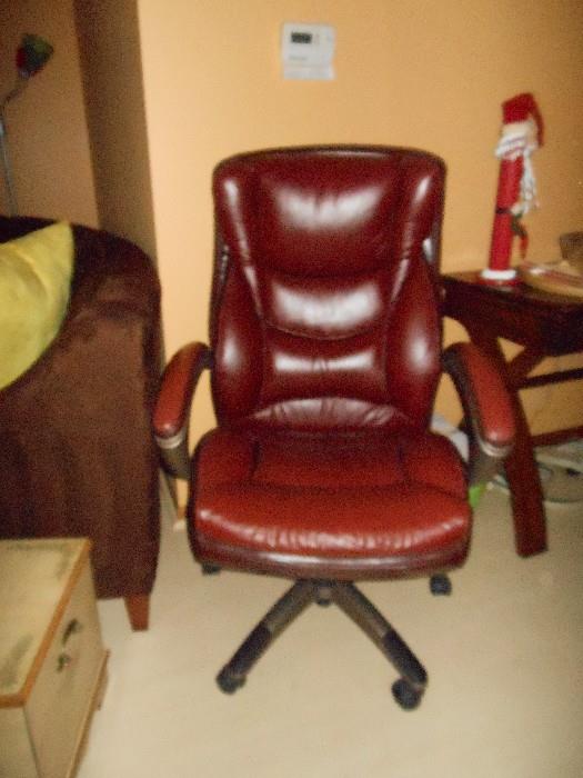 red leather office chair on wheels