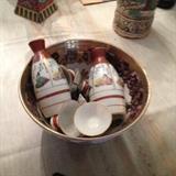 Chinese traditional liquor set.  Warm water fills the bowl, the liquor bottles sit in warm water, the cups are filled with soothing warm liquor to enjoy!