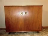 Mid Century Modern, solid wood stereo cabinet (no stereo).  Lift top, double piano hinged doors.  Would make a great home bar.