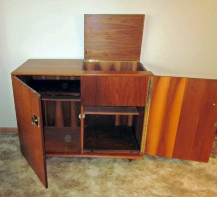 Mid Century Modern, solid wood stereo cabinet (no stereo).  Lift top, double piano hinged doors.  Would make a great home bar.