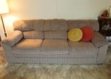 Neutral color velour, softly striped, sofa by Townhouse Penthouse Industries.  Has a matching love seat.