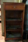 Vintage storage unit with one drawer and three shelves.
