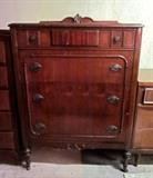 Antique 4-drawer chest on wheels with original ornate brass hardware.