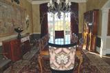 Henredon Rittenhouse Square Banded Burl clawfoot dining table with 8 Chippendale side chairs and 2 head chairs, 2 ebony upholstered chairs, large hand knot Persian area rug