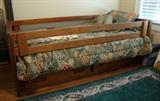 Bed with rails in place, notice built in drawers