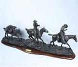 Large Charles M. Russell "Changing Outfits" solid bronze sculpture on a wooden base, from Chesapeake Reproductions. Excellent condition! 34 1/2" long x 12 1/2" high. Item cannot be shipped: winning bidder must pick up this item in person at our San Antonio, Texas gallery.