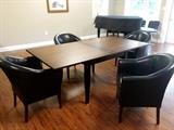 Club chairs and a drop leaf conference table