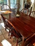 A hand made drop end kitchen table and a set of 8 Windsor Chairs also Hand made!  Also Beautiful!!!!