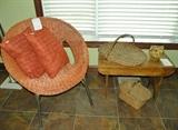 Wicker chair, bench antique baskets and pitcher.