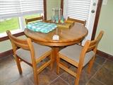 Nice solid oak table with 4 chairs.