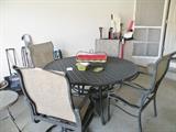 Iron patio table and 4 chairs. 