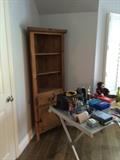Spanish style corner unit, camera, books