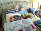 Vintage linens and king size brass bed