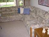 L-Shaped sofa with built in recliner in end